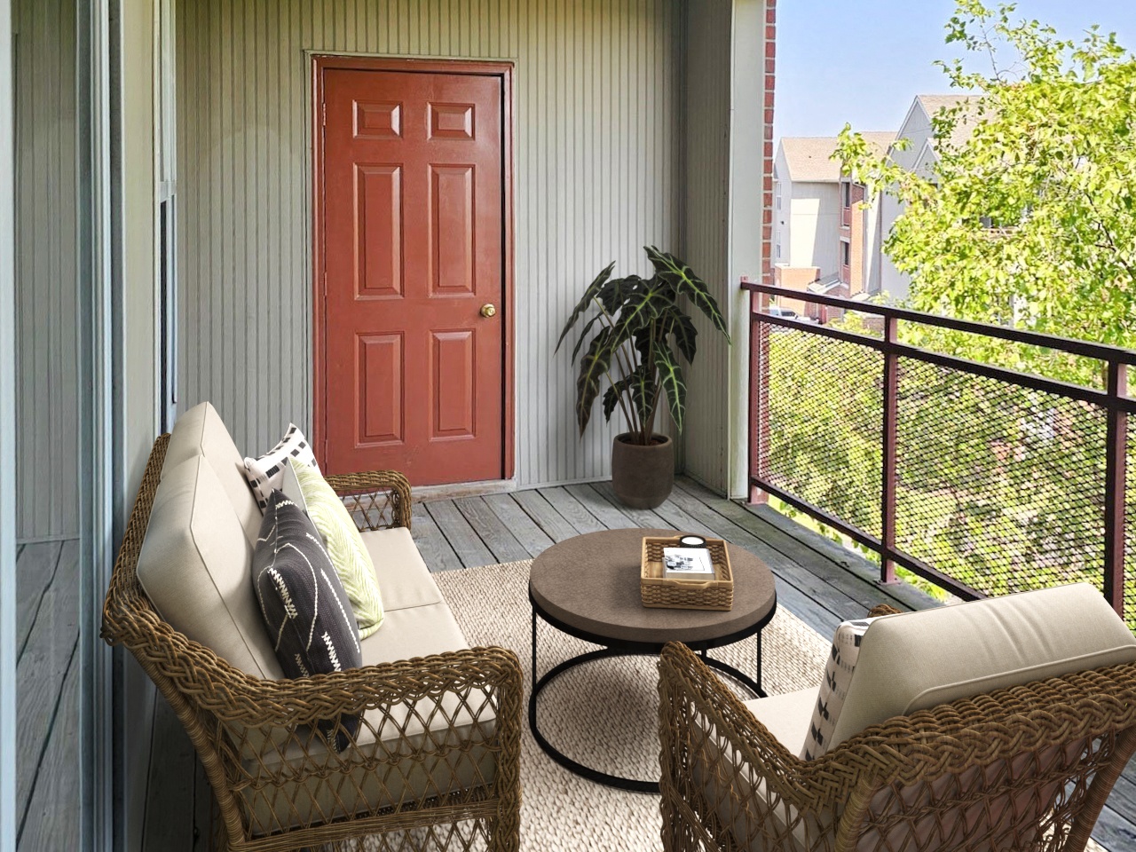 Cozy private balcony with comfortable seating and green views